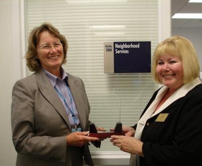 Connie shares the news of her award with Pat Reilly, Director of Prince William County’s Neighborhood Services Division